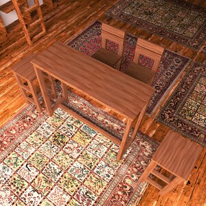 May include: A wooden desk with two matching chairs and two stools sits on a patterned rug. The rug has a floral design with red, green, and yellow accents. The room has a warm, inviting feel.