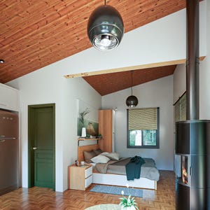 16x20 tiny house plans featuring a modern one-bedroom layout with open living room and kitchen, full bathroom with WC, and a spacious 200 sq ft covered porch with a sloped roof. DIY small house blueprint for affordable cabin, backyard guest house, minimalist living design, and easy construction. Printable architectural floor plan ideal for off-grid, ADU, or vacation tiny home builds.