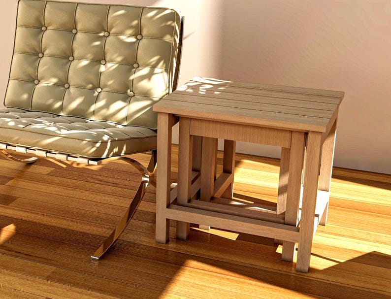 Here, there is a nestable End Table-Side Table or Nesting Coffee Table set consisting of 3 pieces, Large, Medium and Small, placed indoors.