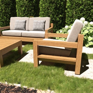 This picture features patio wooden seating set furniture. This patio set has one long, two single sofas, and one coffee table.
