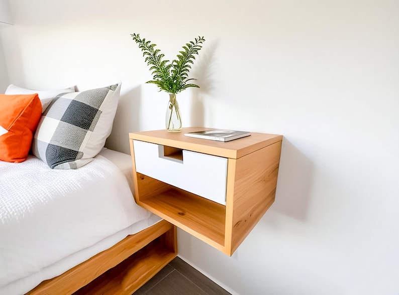 Here is a floating nightstand made of wood placed on the wall in the bedroom. It can also be used in the living room, living room.

Overall Dimensions:
H 10.75 inch, L 16.5 inch, D 14 inch