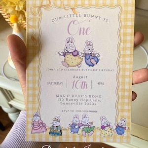 May include: A digital birthday invitation featuring a yellow gingham border and illustrations of bunnies. The text reads "Our Little Bunny is One" and includes party details. The invitation is for Max & Ruby's home.