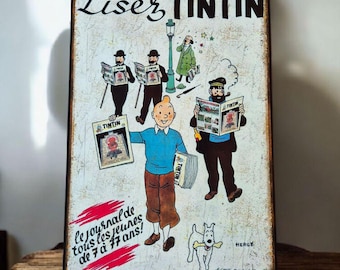 Vintage Tintin metal sign. Read