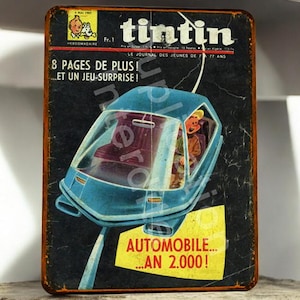 Vintage Tintin and the Year 2000 metal plaque