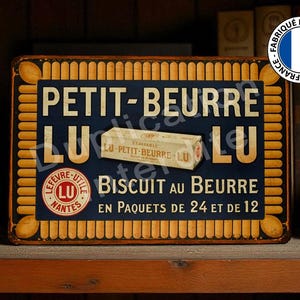 Peut inclure: An old metal sign for Petit-Beurre LU biscuits. The sign is navy blue with yellow lettering and a biscuit border. A small box of biscuits is in the center. It is marked "Fabriqué en France."