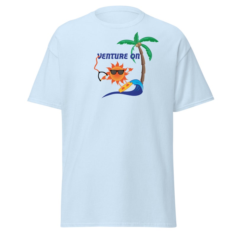 May include: Light blue t-shirt featuring a cartoon sun wearing sunglasses and holding a surfboard. The sun is in front of a palm tree and a wave. The text "Venture On" is above the sun.