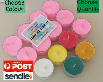 May include: A pack of 12 unscented tealight candles in various colors, including pink, red, yellow, orange, green, and white. The candles are made from 100% soy wax and are hand-poured. The packaging includes the text "Australian Made", "100% Soy Wax", "Uncented Coloured", "Tealight Candles", "8 Pack/4 hours", and "Hand Poured".