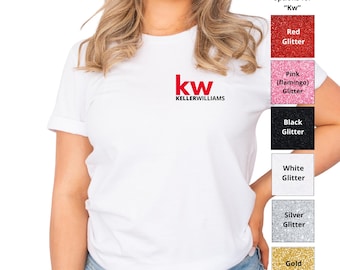 May include: A white short-sleeved t-shirt featuring the red and black Keller Williams logo on the chest. To the right, a vertical color chart displays six glitter options labeled Red, Pink, Black, White, Silver, and Gold Glitter for the logo.