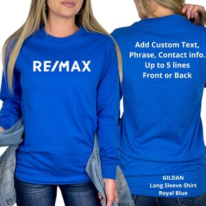 May include: Royal blue long sleeve shirt with the white text "RE/MAX" on the front. The back of the shirt has text that reads "Add Custom Text, Phrase, Contact info. Up to 5 lines Front or Back."