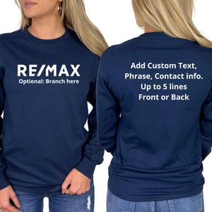 May include: Navy blue long-sleeve shirt with the RE/MAX logo on the front. The back of the shirt has text that says "Add Custom Text, Phrase, Contact info. Up to 5 lines Front or Back."
