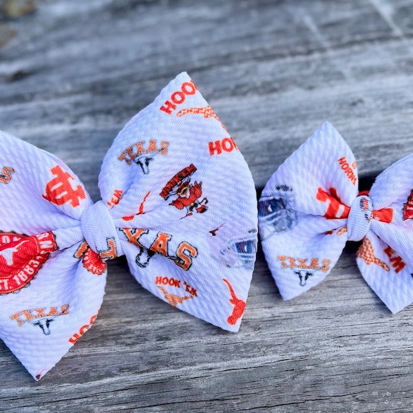 Orange football bows| clip bows | Texas bows | baby football bows | toddler football bows | nylon bows | big baby bows.