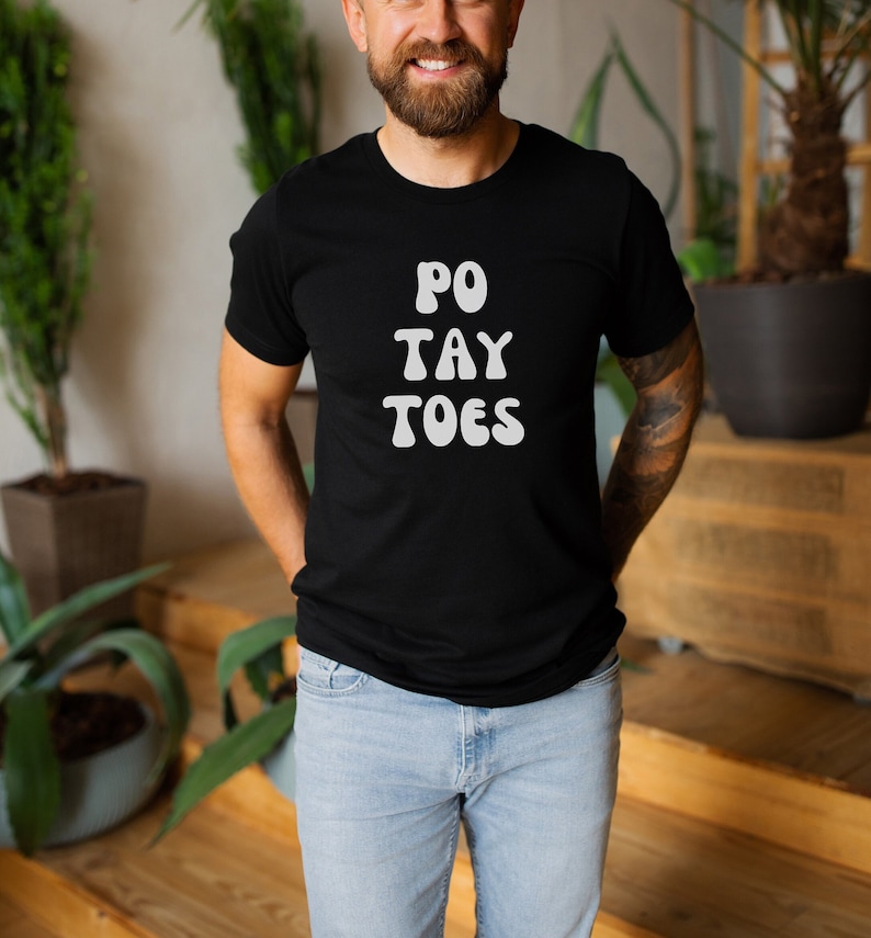 May include: A black t-shirt with white text that reads "PO TAY TOES".