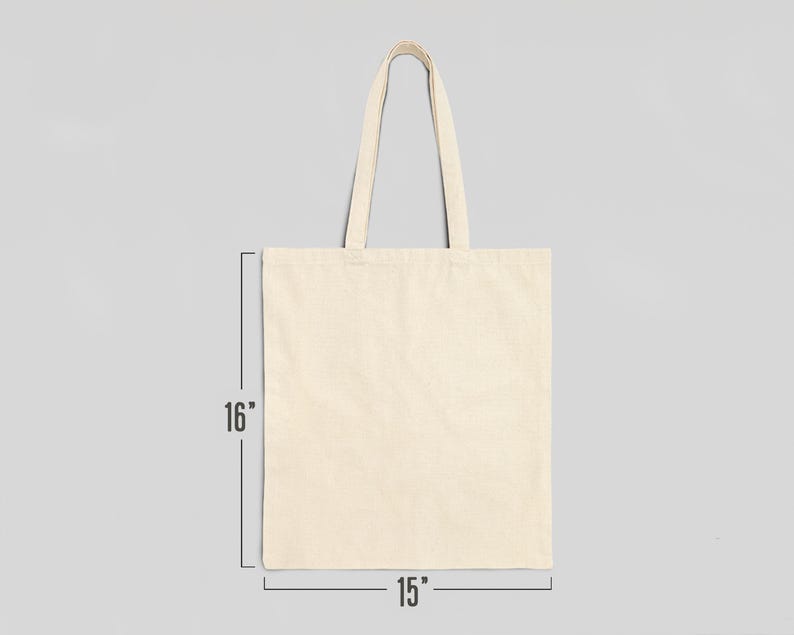 May include: A plain, off-white canvas tote bag with two handles. The bag measures 15 inches wide by 16 inches tall.