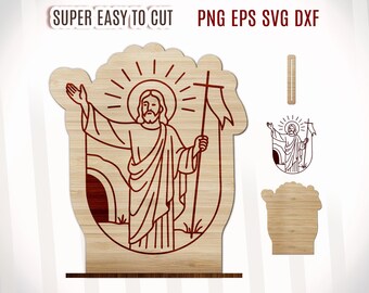 Può includere: Un ritaglio in legno di Gesù Cristo che emerge da una tomba con una croce e uno stendardo. Il ritaglio è in una cornice circolare con una texture a grana di legno.