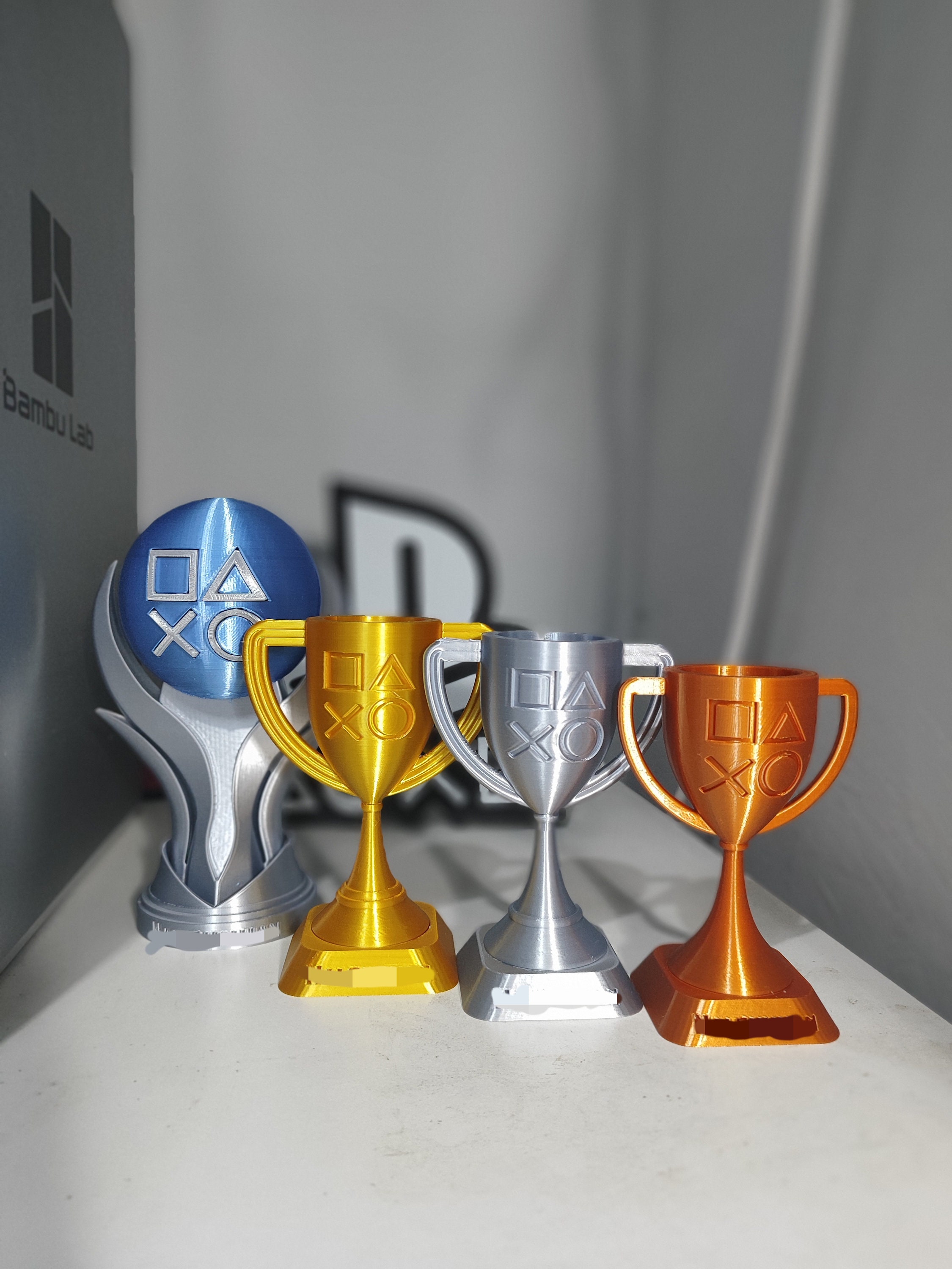 Playstation 5 3D Trophies Platinum , Gold , Silver , Bronze and Playstation 5 3D Trophies Platinum , Gold , Silver , Bronze and