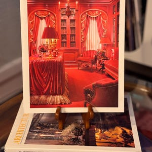 May include: A set of three ceramic mugs with a speckled, matte finish. The mugs are in shades of cream, light gray, and dark gray. Each mug has a simple, minimalist design and a rounded handle.