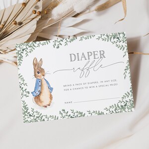 5x3.5 Peter Rabbit Baby Shower Diaper Raffle Ticket, with a green leafy border, and grey text. You can personalise your editable templates in Corjl.