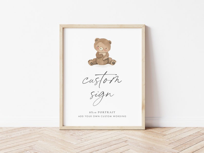 A modern 8x10 Custom Sign for Baby Showers and Birthday Parties, with the sweetest little brown teddy bear holding a flag and marching. The editable elegant dark grey text is personalisable in Corjl.