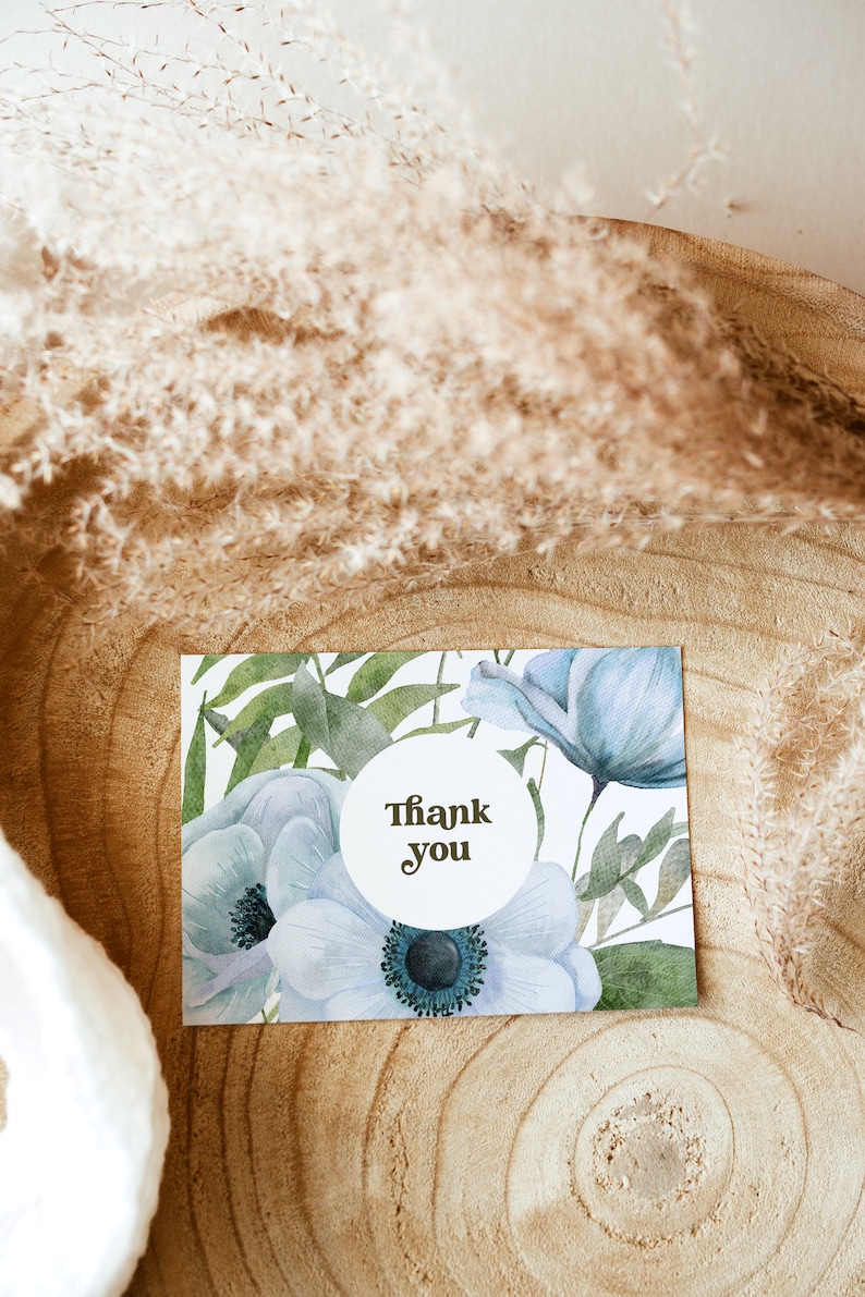 An elegant blue floral 5x3.5 Landscape Baby Shower Thank You Card. Thank You text is in brown. You can personalise your editable Thank You Card template in Corjl.