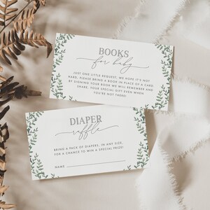 3.5x2 Greenery Baby Shower Books for Baby Insert Card and Diaper Raffle Ticket, with green leaves on the horizontal borders, and grey text. You can personalise your editable templates in Corjl.