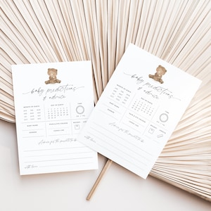 A 5x7-inch baby predictions and advice card for a teddy bear-themed baby shower, part of the We Can Bearly Wait Baby Shower theme pack. The card features a cute brown teddy bear illustration alongside elegant grey modern script text.