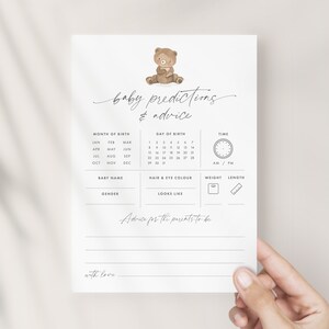 A 5x7-inch baby predictions and advice card for a teddy bear-themed baby shower, part of the We Can Bearly Wait Baby Shower theme pack. The card features a cute brown teddy bear illustration alongside elegant grey modern script text.