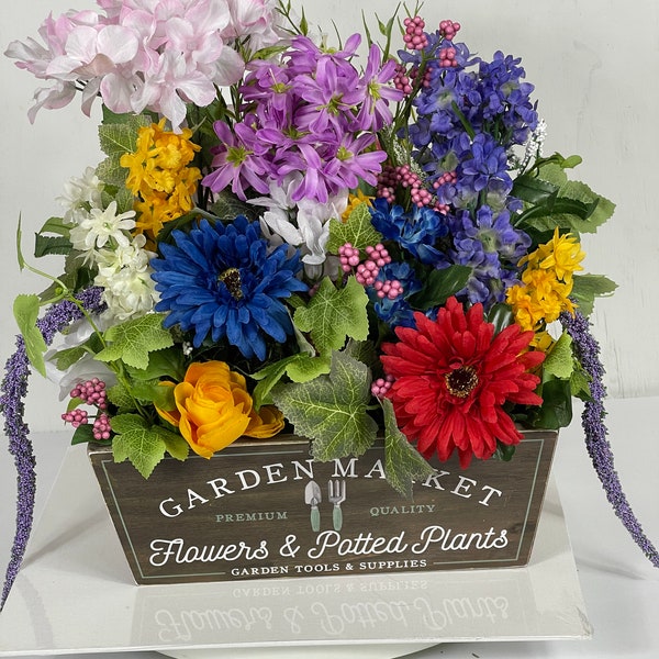 Bright floral centerpiece to enhance any area such as kitchen counter, end table, or mantle.