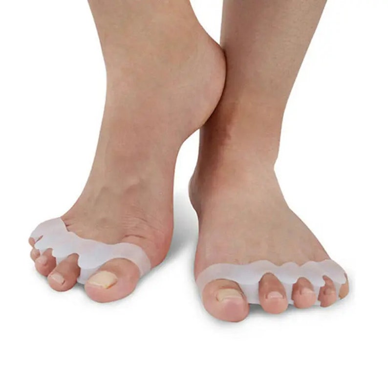 May include: A pair of clear silicone toe separators designed to help align toes and reduce discomfort. The separators are worn between the toes and are made of a soft, flexible material.