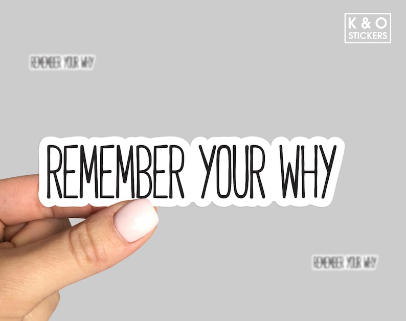 K&ouml;nnte beinhalten: Wei&szlig;er Aufkleber mit schwarzem Text, der "Remember Your Why" lautet.
