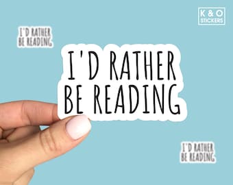 May include: White sticker with black text that reads "I'd rather be reading".