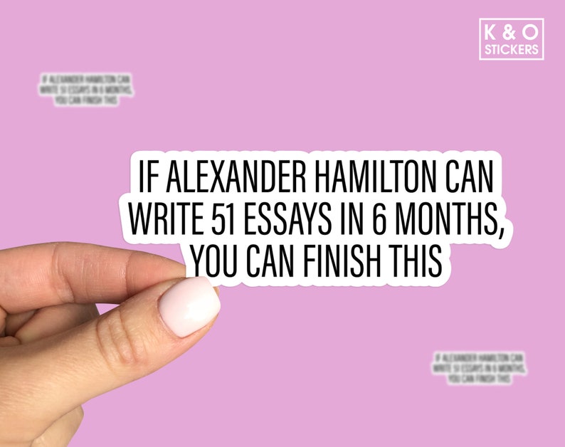 May include: A white sticker with black text that reads "If Alexander Hamilton can write 51 essays in 6 months, you can finish this". The sticker is being held by a hand against a pink background.