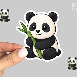 May include: A sticker featuring a cartoon panda bear with black and white fur, holding a green bamboo stalk. Two smaller panda stickers are also visible. The sticker has a white border. The text "K & O Stickers" is in the upper right corner.