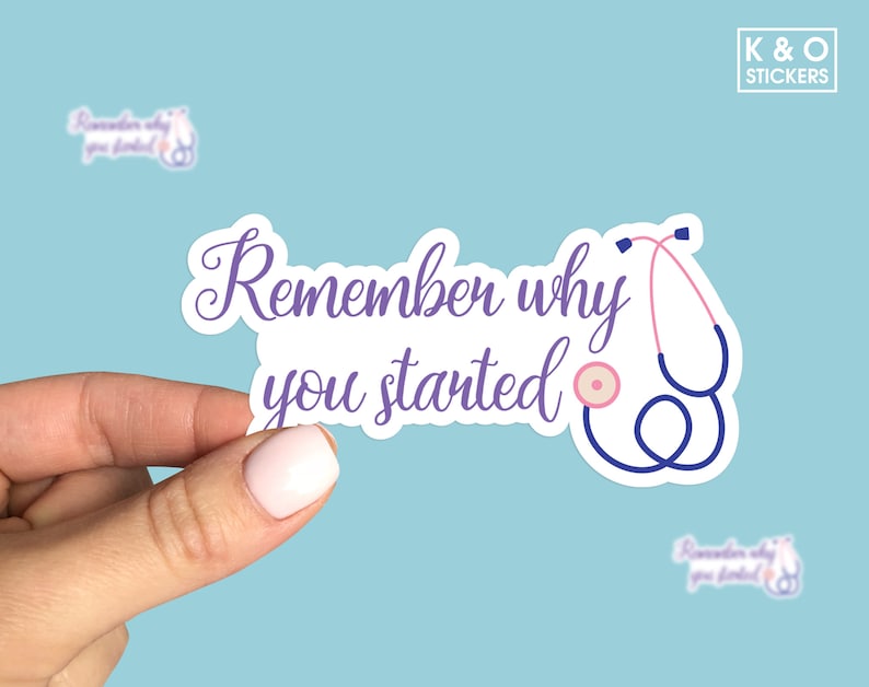以下が含まれることがあります： ステートスコープと「Remember why you started」というテキストが書かれた、紫と白のステッカーです。