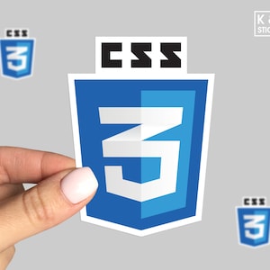 May include: A blue and white CSS3 logo sticker. The sticker features the text "CSS" in black letters above a blue and white stylized number "3".