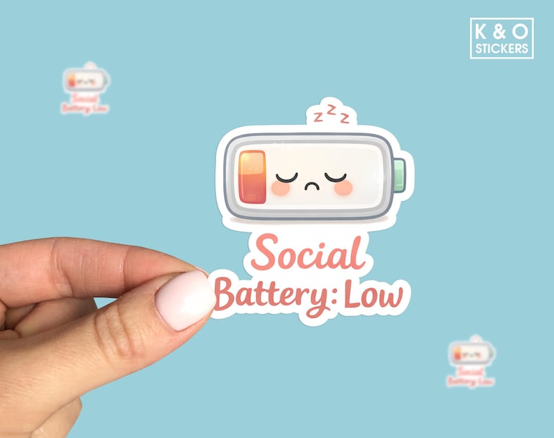 Cute sleepy battery illustration with a low charge indicator and the text “Social Battery: Low,” in a soft kawaii style on a white background, perfect for introvert and mental health humor.