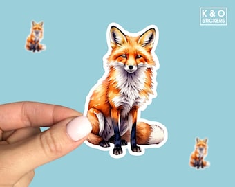 May include: A sticker featuring a detailed illustration of a red fox sitting with its tail curled around its body. The fox has a white chest and a fluffy tail.