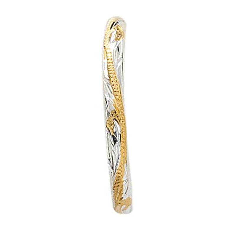 May include: A thin silver band with a gold filigree design. The band is curved and has a smooth finish.