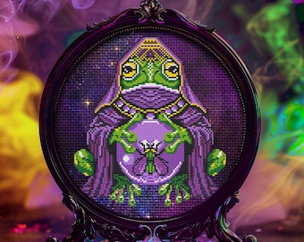 May include: A purple and green embroidered frog wearing a crown and holding a crystal ball. The embroidery is framed in a black ornate frame.