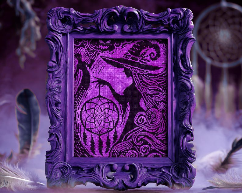 May include: A framed cross-stitch artwork in shades of purple and black. The image features a witch holding a dreamcatcher. The ornate frame is a deep purple. Feathers and a dreamcatcher are in the background, creating a mystical theme.