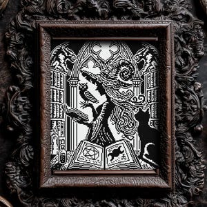 May include: Black and white cross-stitch art of a witch reading a spell book, with an owl and cat. The artwork is framed in a dark, ornate wooden frame. The witch is wearing a tall hat and is surrounded by gothic architecture.
