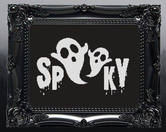 May include: Black and white cross-stitch embroidery in a black frame. The embroidery depicts two ghosts and the word "Spooky" with dripping letters.