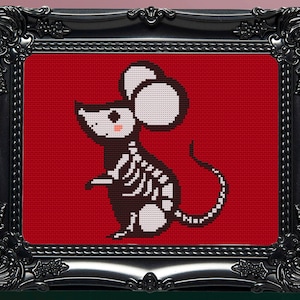 May include: A cross-stitch pattern of a skeleton mouse with a white head and a red background. The mouse is standing on its hind legs with its tail curled behind it.