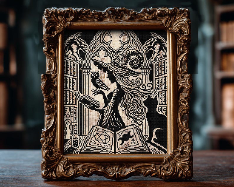 May include: A framed cross-stitch artwork featuring a witch silhouette with an owl and a black cat. The artwork is in black and cream colors, set against a backdrop of a gothic window and bookshelves. The frame is ornate, with a gold finish.