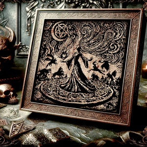 May include: A framed cross-stitch embroidery depicting a woman in a long flowing gown with her arms outstretched, standing in a circle with a pentagram and crescent moon above her. The background is a swirling pattern of dark grey and black.