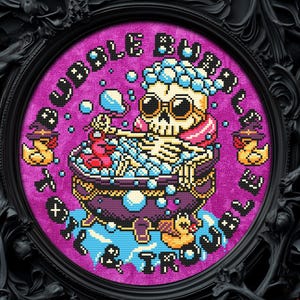 May include: Cross-stitch art in a black frame features a skeleton in a bathtub with bubbles, wearing sunglasses and a scarf. The text "Bubble Bath & Trouble" surrounds the image. Yellow rubber duckies with witch hats are also in the image.