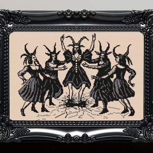 May include: Black and white cross-stitch embroidery of five figures with horns and cloven hooves, dancing around a fire in a circle. The figures are wearing long dresses and have long hair. The background is a light beige.