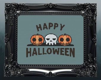 May include: A black framed picture with a blue background and the text "HAPPY HALLOWEEN" in brown letters. There are three pixelated images: two orange pumpkins with black eyes and a white skull with black eyes.
