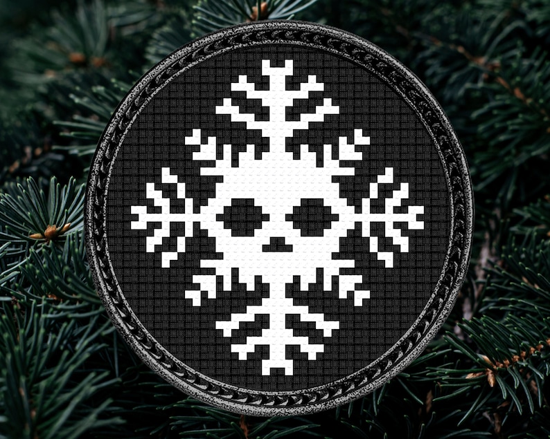 May include: A black and white circular ornament with a snowflake design. The snowflake has a skull in the center.