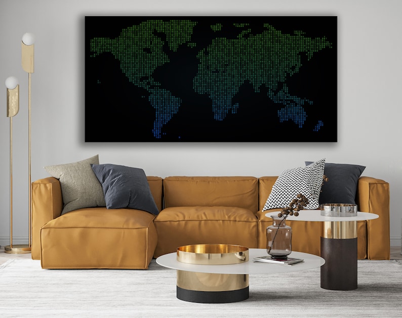 May include: A modern living room featuring a brown leather sectional sofa, two coffee tables, and a gold floor lamp. A large black and green world map print hangs on the wall above the sofa.