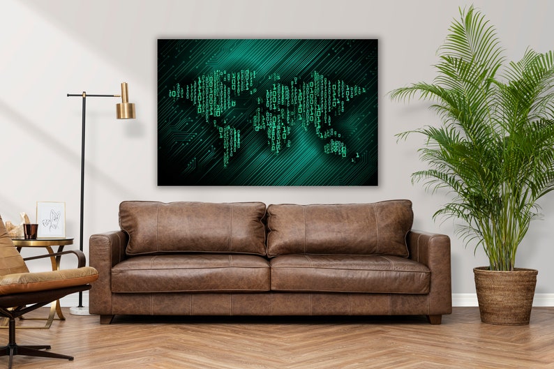 May include: A digital art print of a world map made of green circuit board lines on a dark blue background. The print is hanging on a white wall above a brown leather sofa.